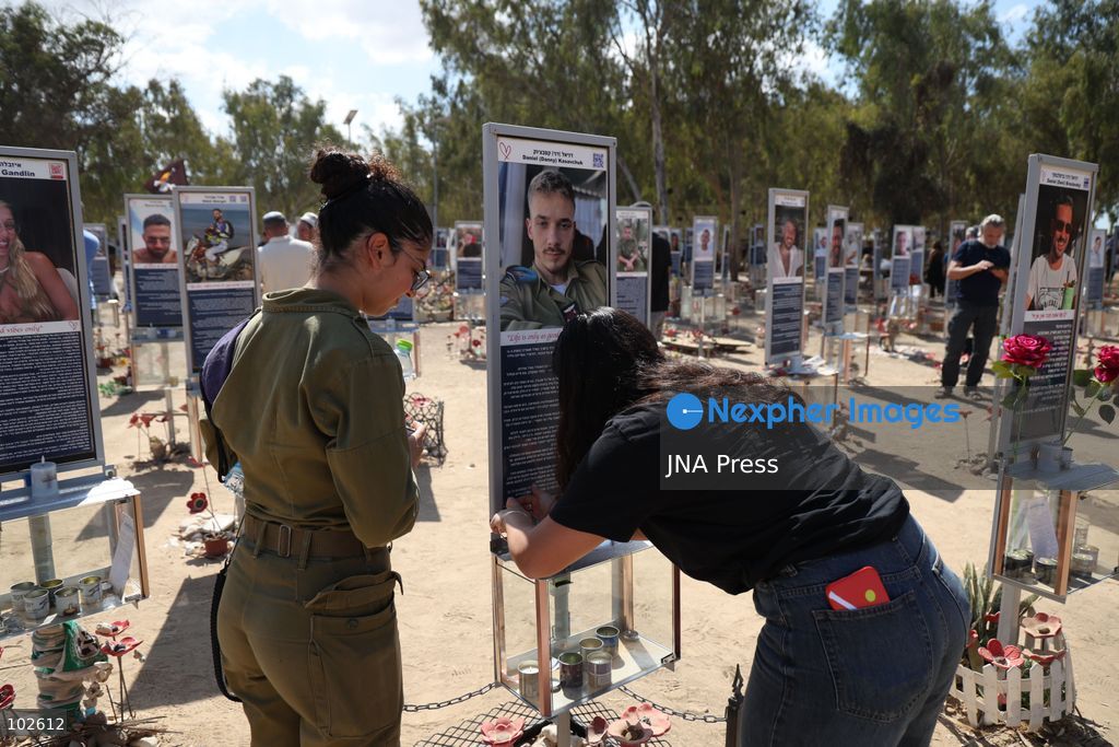 RE’IM, ISRAEL, OCTOBER 7, 2026: Israelis visit the Nova music festival memorial site near Re’im to mark the third anniversary of the October 7, 2023 attack. Visitors walk among memorials bearing the photographs and names of people killed at the festival site, where hundreds were killed during the Hamas-led attack three years earlier. Families, friends and members of the public gathered at the site to remember the victims and pay tribute to those killed. Photo by Saeed Qaq / JNA Press. (Photo by Saeed Qaq/JNA Press via Nexpher Images)