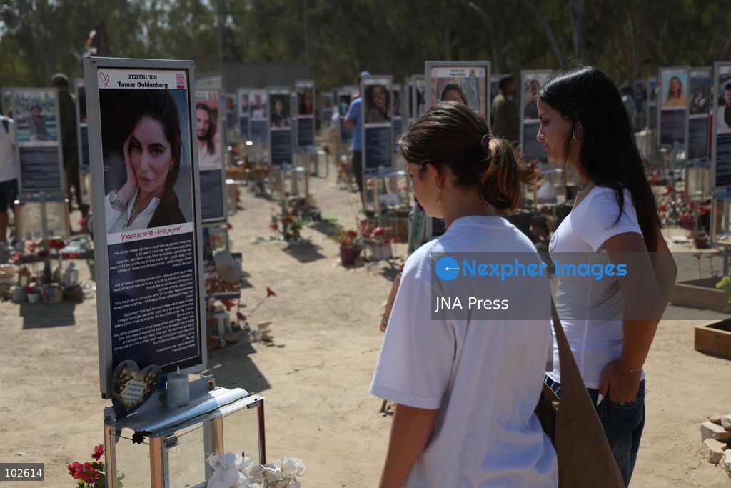 RE’IM, ISRAEL, OCTOBER 7, 2026: Israelis visit the Nova music festival memorial site near Re’im to mark the third anniversary of the October 7, 2023 attack. Visitors walk among memorials bearing the photographs and names of people killed at the festival site, where hundreds were killed during the Hamas-led attack three years earlier. Families, friends and members of the public gathered at the site to remember the victims and pay tribute to those killed. Photo by Saeed Qaq / JNA Press. (Photo by Saeed Qaq/JNA Press via Nexpher Images)