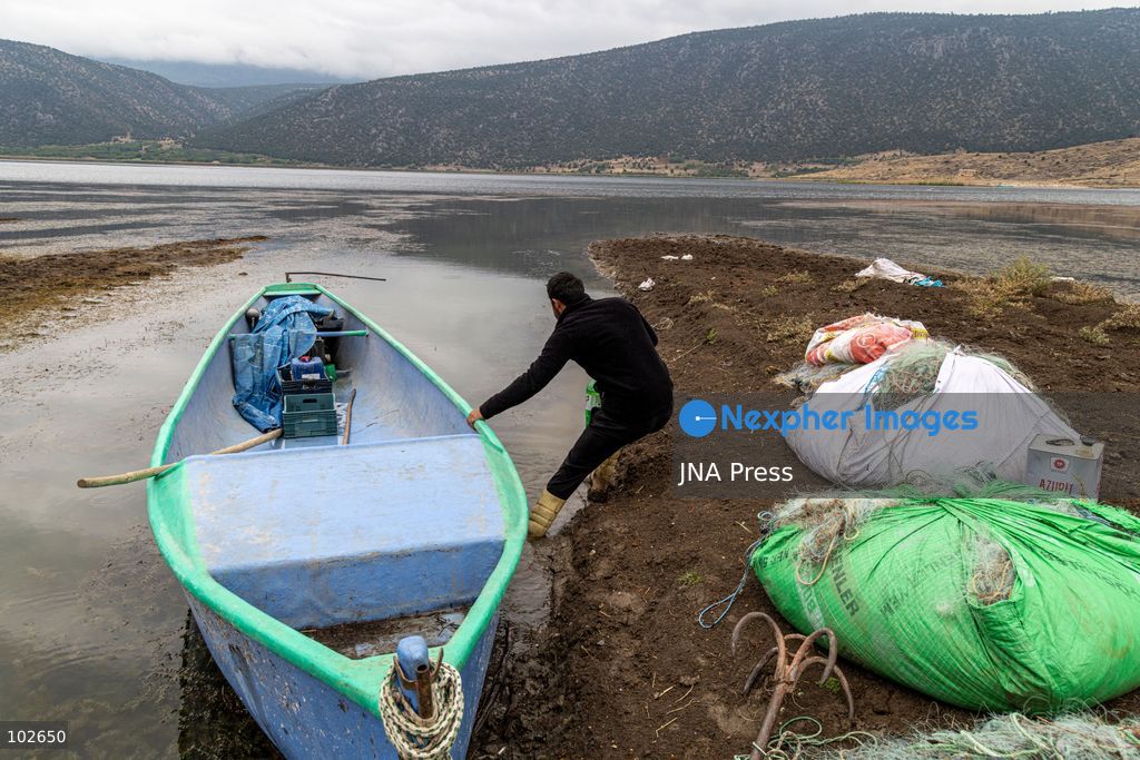 MADA ISLAND, BEYSEHIR, TURKEY, OCTOBER 2026: Residents go about their daily lives on Mada Island in Lake Beysehir, where a small community continues to depend largely on fishing as the island's population declines. With no road connection, school, grocery store or health centre, residents rely on small boats to reach the mainland for basic services and supplies. Local fishermen say falling water levels, pollution and declining catches in Lake Beysehir are adding to economic pressures and encouraging younger residents to leave. Celal Er, a fisherman raising his young child on the island, says his catch over the past week did not cover the cost of fuel for his boat and that he is considering leaving when his child reaches school age. The community's declining population and limited access to essential services are putting increasing pressure on a way of life sustained on the island for generations. Photo by Emrullah Gumus / JNA Press (Photo by Emrullah GümüÅ/JNA Press via Nexpher Images)
