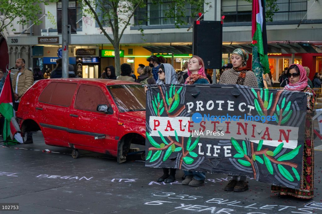 MELBOURNE, AUSTRALIA – OCTOBER 7, 2026: A day-long vigil in solidarity with the people of Gaza was held at the State Library of Victoria, with attendees taking part in a sit-in from 10:00 AM to 5:00 PM, followed by a commemoration from 5:00 PM to 6:00 PM to honour and remember people killed in Gaza. During the vigil, attendees made paper poppies and placed them throughout the garden in front of the library. A car marked with numerous bullet holes, presented as a representation of the vehicle in which Hind Rajab was trapped and killed in Gaza, was displayed at the site. A recording of Rajab's final call for help was also played over a speaker. The names and ages of people who had died were read aloud during the commemoration. Photo by Huda Shehzad / JNA Press. (Photo by Huda Shehzad/JNA Press via Nexpher Images)