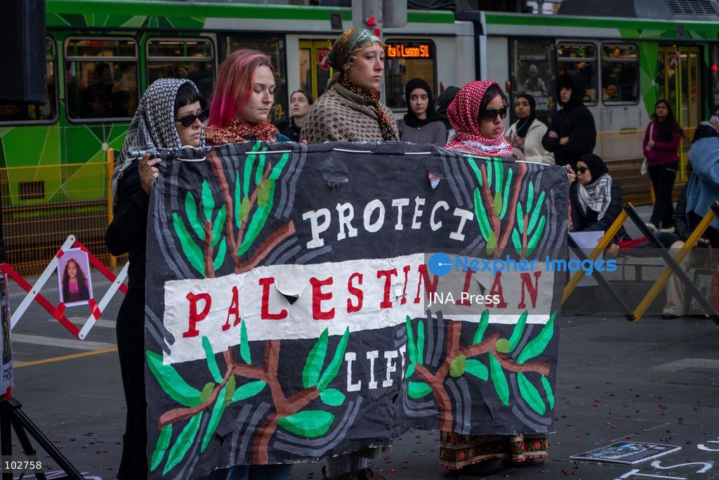 MELBOURNE, AUSTRALIA – OCTOBER 7, 2026: A day-long vigil in solidarity with the people of Gaza was held at the State Library of Victoria, with attendees taking part in a sit-in from 10:00 AM to 5:00 PM, followed by a commemoration from 5:00 PM to 6:00 PM to honour and remember people killed in Gaza. During the vigil, attendees made paper poppies and placed them throughout the garden in front of the library. A car marked with numerous bullet holes, presented as a representation of the vehicle in which Hind Rajab was trapped and killed in Gaza, was displayed at the site. A recording of Rajab's final call for help was also played over a speaker. The names and ages of people who had died were read aloud during the commemoration. Photo by Huda Shehzad / JNA Press. (Photo by Huda Shehzad/JNA Press via Nexpher Images)