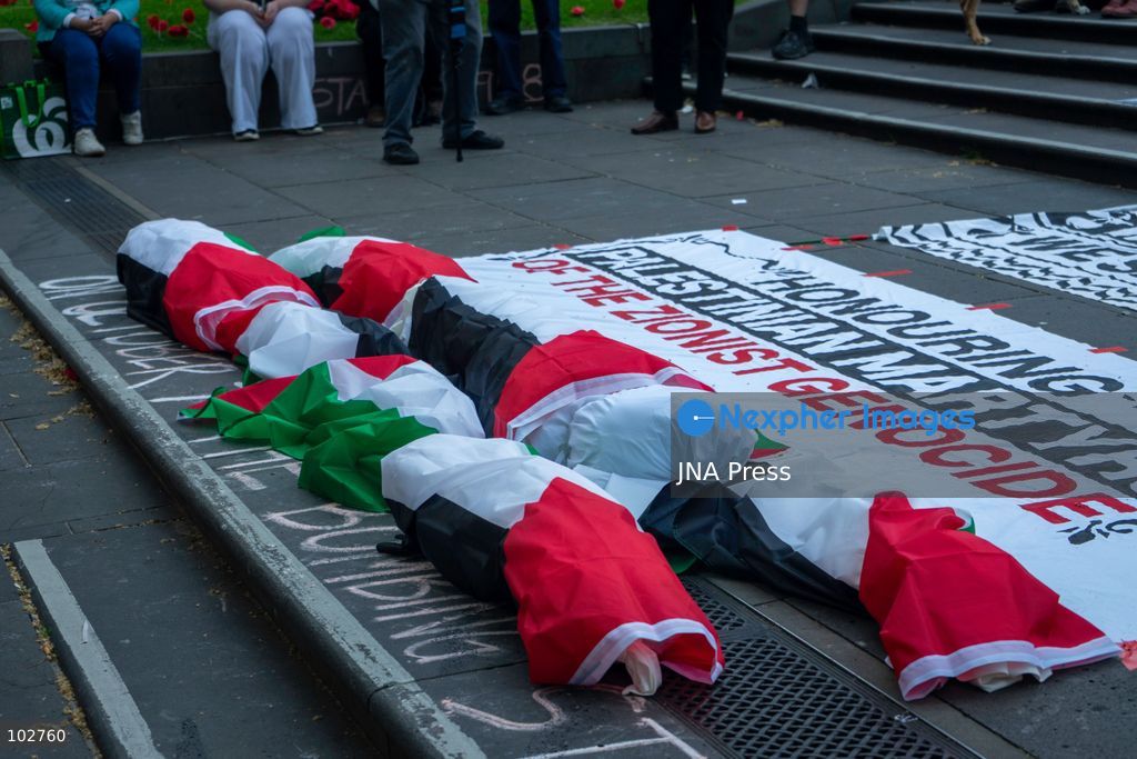 MELBOURNE, AUSTRALIA – OCTOBER 7, 2026: A day-long vigil in solidarity with the people of Gaza was held at the State Library of Victoria, with attendees taking part in a sit-in from 10:00 AM to 5:00 PM, followed by a commemoration from 5:00 PM to 6:00 PM to honour and remember people killed in Gaza. During the vigil, attendees made paper poppies and placed them throughout the garden in front of the library. A car marked with numerous bullet holes, presented as a representation of the vehicle in which Hind Rajab was trapped and killed in Gaza, was displayed at the site. A recording of Rajab's final call for help was also played over a speaker. The names and ages of people who had died were read aloud during the commemoration. Photo by Huda Shehzad / JNA Press. (Photo by Huda Shehzad/JNA Press via Nexpher Images)