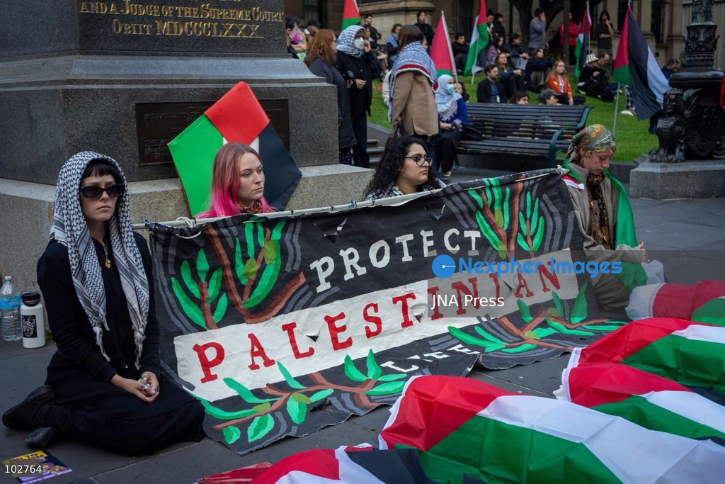 MELBOURNE, AUSTRALIA – OCTOBER 7, 2026: A day-long vigil in solidarity with the people of Gaza was held at the State Library of Victoria, with attendees taking part in a sit-in from 10:00 AM to 5:00 PM, followed by a commemoration from 5:00 PM to 6:00 PM to honour and remember people killed in Gaza. During the vigil, attendees made paper poppies and placed them throughout the garden in front of the library. A car marked with numerous bullet holes, presented as a representation of the vehicle in which Hind Rajab was trapped and killed in Gaza, was displayed at the site. A recording of Rajab's final call for help was also played over a speaker. The names and ages of people who had died were read aloud during the commemoration. Photo by Huda Shehzad / JNA Press. (Photo by Huda Shehzad/JNA Press via Nexpher Images)