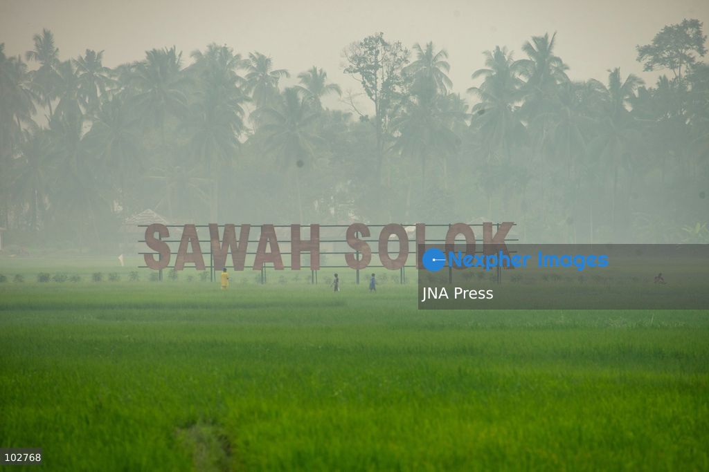 SOLOK, WEST SUMATRA, INDONESIA – OCTOBER 7, 2026: Residents move through Solok, West Sumatra, amid haze linked to widespread forest and land fires on the Indonesian islands of Sumatra and Kalimantan. The fires have contributed to persistent air pollution affecting parts of Indonesia, Malaysia and Singapore. Data from IQAir indicated that the air quality index in West Sumatra reached 189, a level classified as unhealthy and approaching the very unhealthy range. The prolonged haze has affected visibility and raised concerns over air quality and public health across affected areas. The fires are part of recurring seasonal wildfire and land-burning incidents in Indonesia that can produce extensive smoke and transboundary haze. Photo by Wawan Kurniawan / JNA Press. (Photo by Wawan Kurniawan/JNA Press via Nexpher Images)