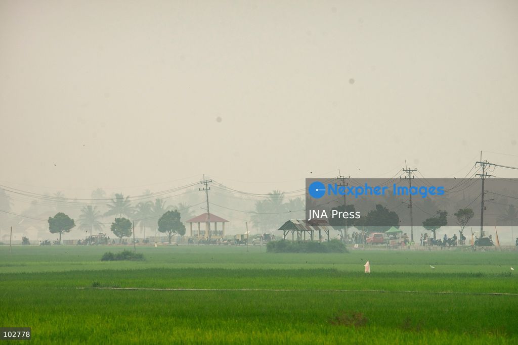 SOLOK, WEST SUMATRA, INDONESIA – OCTOBER 7, 2026: Residents move through Solok, West Sumatra, amid haze linked to widespread forest and land fires on the Indonesian islands of Sumatra and Kalimantan. The fires have contributed to persistent air pollution affecting parts of Indonesia, Malaysia and Singapore. Data from IQAir indicated that the air quality index in West Sumatra reached 189, a level classified as unhealthy and approaching the very unhealthy range. The prolonged haze has affected visibility and raised concerns over air quality and public health across affected areas. The fires are part of recurring seasonal wildfire and land-burning incidents in Indonesia that can produce extensive smoke and transboundary haze. Photo by Wawan Kurniawan / JNA Press. (Photo by Wawan Kurniawan/JNA Press via Nexpher Images)