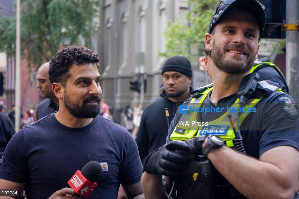 MELBOURNE, AUSTRALIA – OCTOBER 7, 2026: A vigil in solidarity with the people of Gaza was held at the State Library of Victoria, with attendees participating in a sit-in from 10:00 AM to 5:00 PM, followed by a commemoration event from 5:00 PM to 6:00 PM to remember those killed. During the event, Avi Yemini of Rebel News Australia arrived with a crew seeking interviews with attendees. Police formed a barricade, while event marshals and police maintained a line to prevent Yemini and his crew from entering the vigil area. According to event organizers, Yemini repeatedly collided with police and attempted to evade the barricade. Photo by Huda Shehzad / JNA Press. (Photo by Huda Shehzad/JNA Press via Nexpher Images)