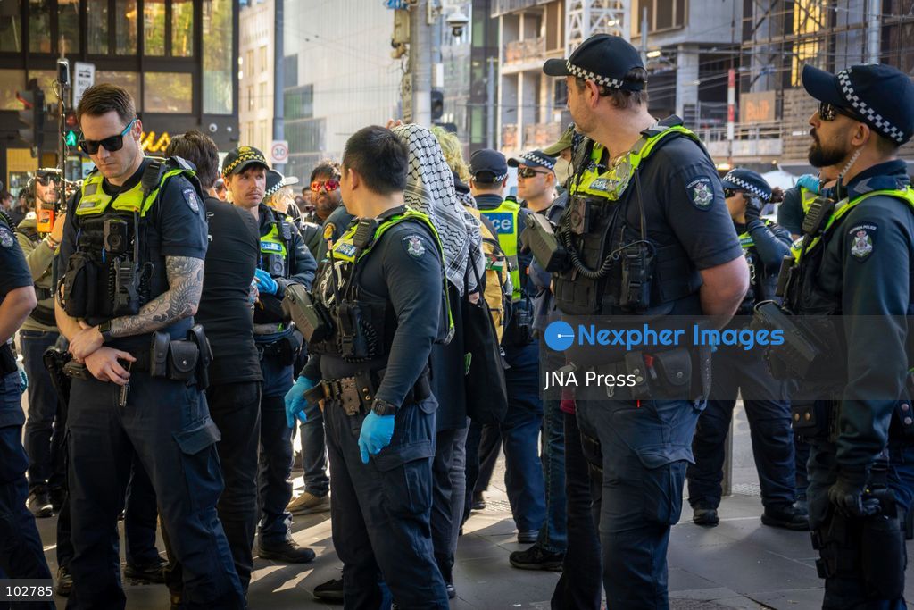MELBOURNE, AUSTRALIA – OCTOBER 7, 2026: A vigil in solidarity with the people of Gaza was held at the State Library of Victoria, with attendees participating in a sit-in from 10:00 AM to 5:00 PM, followed by a commemoration event from 5:00 PM to 6:00 PM to remember those killed. During the event, Avi Yemini of Rebel News Australia arrived with a crew seeking interviews with attendees. Police formed a barricade, while event marshals and police maintained a line to prevent Yemini and his crew from entering the vigil area. According to event organizers, Yemini repeatedly collided with police and attempted to evade the barricade. Photo by Huda Shehzad / JNA Press. (Photo by Huda Shehzad/JNA Press via Nexpher Images)