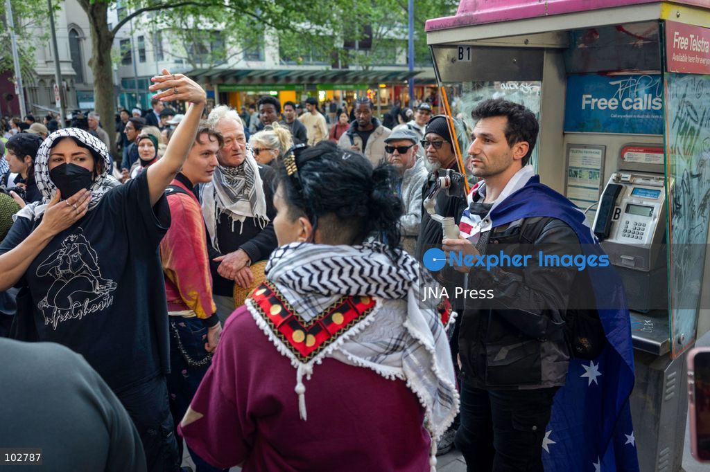 MELBOURNE, AUSTRALIA – OCTOBER 7, 2026: A vigil in solidarity with the people of Gaza was held at the State Library of Victoria, with attendees participating in a sit-in from 10:00 AM to 5:00 PM, followed by a commemoration event from 5:00 PM to 6:00 PM to remember those killed. During the event, Avi Yemini of Rebel News Australia arrived with a crew seeking interviews with attendees. Police formed a barricade, while event marshals and police maintained a line to prevent Yemini and his crew from entering the vigil area. According to event organizers, Yemini repeatedly collided with police and attempted to evade the barricade. Photo by Huda Shehzad / JNA Press. (Photo by Huda Shehzad/JNA Press via Nexpher Images)