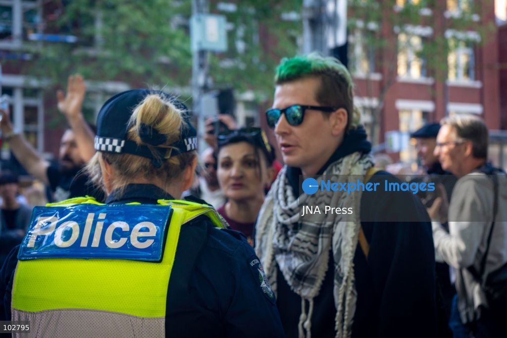 MELBOURNE, AUSTRALIA – OCTOBER 7, 2026: A vigil in solidarity with the people of Gaza was held at the State Library of Victoria, with attendees participating in a sit-in from 10:00 AM to 5:00 PM, followed by a commemoration event from 5:00 PM to 6:00 PM to remember those killed. During the event, Avi Yemini of Rebel News Australia arrived with a crew seeking interviews with attendees. Police formed a barricade, while event marshals and police maintained a line to prevent Yemini and his crew from entering the vigil area. According to event organizers, Yemini repeatedly collided with police and attempted to evade the barricade. Photo by Huda Shehzad / JNA Press. (Photo by Huda Shehzad/JNA Press via Nexpher Images)