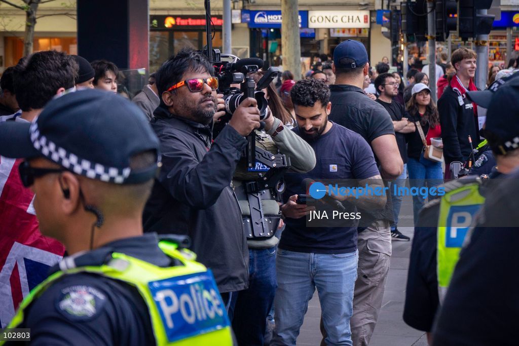 MELBOURNE, AUSTRALIA – OCTOBER 7, 2026: A vigil in solidarity with the people of Gaza was held at the State Library of Victoria, with attendees participating in a sit-in from 10:00 AM to 5:00 PM, followed by a commemoration event from 5:00 PM to 6:00 PM to remember those killed. During the event, Avi Yemini of Rebel News Australia arrived with a crew seeking interviews with attendees. Police formed a barricade, while event marshals and police maintained a line to prevent Yemini and his crew from entering the vigil area. According to event organizers, Yemini repeatedly collided with police and attempted to evade the barricade. Photo by Huda Shehzad / JNA Press. (Photo by Huda Shehzad/JNA Press via Nexpher Images)