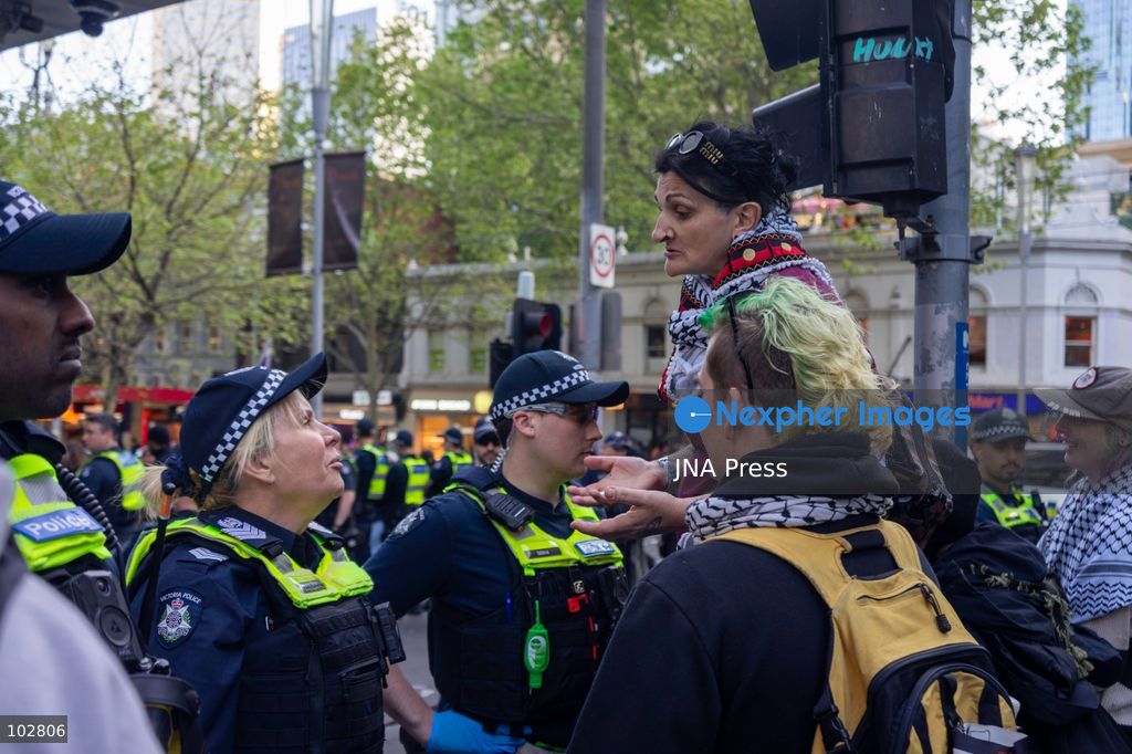 MELBOURNE, AUSTRALIA – OCTOBER 7, 2026: A vigil in solidarity with the people of Gaza was held at the State Library of Victoria, with attendees participating in a sit-in from 10:00 AM to 5:00 PM, followed by a commemoration event from 5:00 PM to 6:00 PM to remember those killed. During the event, Avi Yemini of Rebel News Australia arrived with a crew seeking interviews with attendees. Police formed a barricade, while event marshals and police maintained a line to prevent Yemini and his crew from entering the vigil area. According to event organizers, Yemini repeatedly collided with police and attempted to evade the barricade. Photo by Huda Shehzad / JNA Press. (Photo by Huda Shehzad/JNA Press via Nexpher Images)