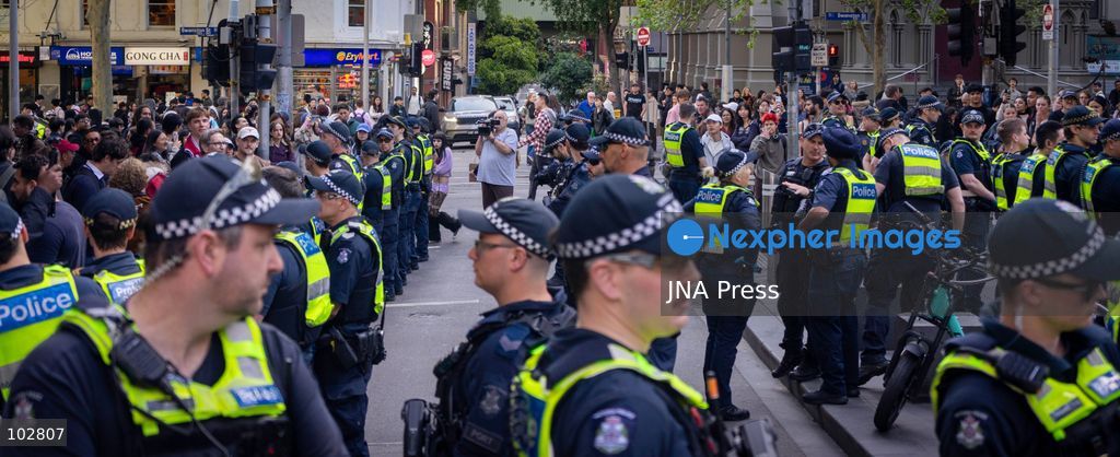 MELBOURNE, AUSTRALIA – OCTOBER 7, 2026: A vigil in solidarity with the people of Gaza was held at the State Library of Victoria, with attendees participating in a sit-in from 10:00 AM to 5:00 PM, followed by a commemoration event from 5:00 PM to 6:00 PM to remember those killed. During the event, Avi Yemini of Rebel News Australia arrived with a crew seeking interviews with attendees. Police formed a barricade, while event marshals and police maintained a line to prevent Yemini and his crew from entering the vigil area. According to event organizers, Yemini repeatedly collided with police and attempted to evade the barricade. Photo by Huda Shehzad / JNA Press. (Photo by Huda Shehzad/JNA Press via Nexpher Images)