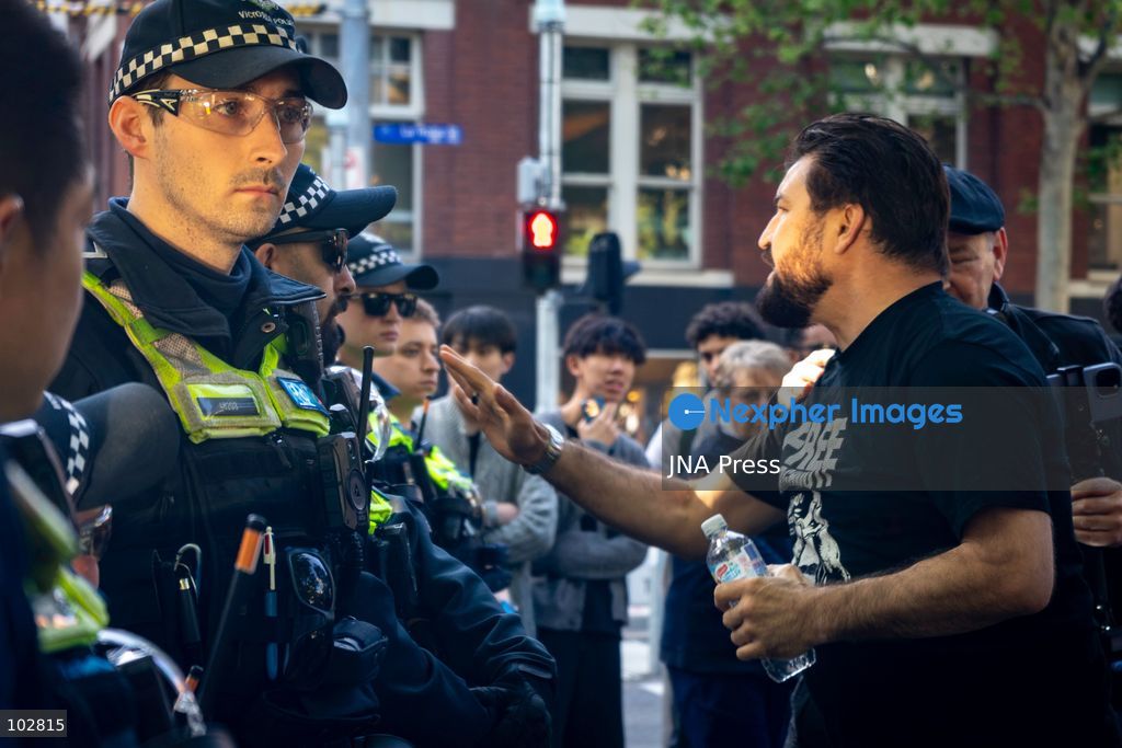 MELBOURNE, AUSTRALIA – OCTOBER 7, 2026: A vigil in solidarity with the people of Gaza was held at the State Library of Victoria, with attendees participating in a sit-in from 10:00 AM to 5:00 PM, followed by a commemoration event from 5:00 PM to 6:00 PM to remember those killed. During the event, Avi Yemini of Rebel News Australia arrived with a crew seeking interviews with attendees. Police formed a barricade, while event marshals and police maintained a line to prevent Yemini and his crew from entering the vigil area. According to event organizers, Yemini repeatedly collided with police and attempted to evade the barricade. Photo by Huda Shehzad / JNA Press. (Photo by Huda Shehzad/JNA Press via Nexpher Images)