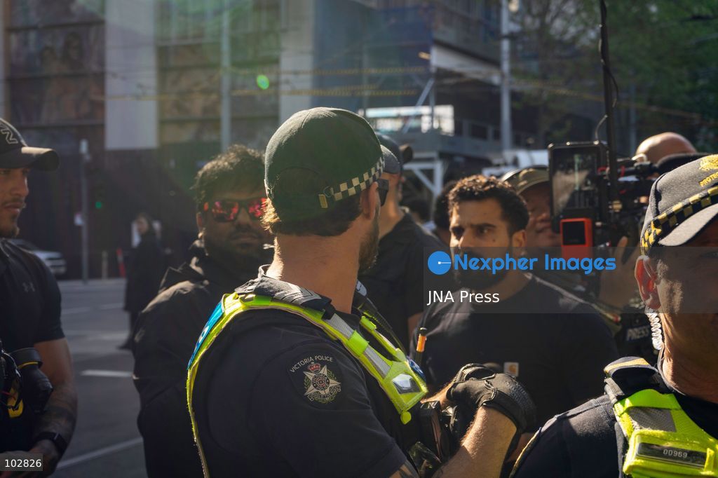 MELBOURNE, AUSTRALIA – OCTOBER 7, 2026: A vigil in solidarity with the people of Gaza was held at the State Library of Victoria, with attendees participating in a sit-in from 10:00 AM to 5:00 PM, followed by a commemoration event from 5:00 PM to 6:00 PM to remember those killed. During the event, Avi Yemini of Rebel News Australia arrived with a crew seeking interviews with attendees. Police formed a barricade, while event marshals and police maintained a line to prevent Yemini and his crew from entering the vigil area. According to event organizers, Yemini repeatedly collided with police and attempted to evade the barricade. Photo by Huda Shehzad / JNA Press. (Photo by Huda Shehzad/JNA Press via Nexpher Images)
