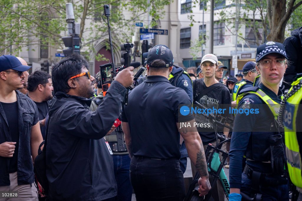 MELBOURNE, AUSTRALIA – OCTOBER 7, 2026: A vigil in solidarity with the people of Gaza was held at the State Library of Victoria, with attendees participating in a sit-in from 10:00 AM to 5:00 PM, followed by a commemoration event from 5:00 PM to 6:00 PM to remember those killed. During the event, Avi Yemini of Rebel News Australia arrived with a crew seeking interviews with attendees. Police formed a barricade, while event marshals and police maintained a line to prevent Yemini and his crew from entering the vigil area. According to event organizers, Yemini repeatedly collided with police and attempted to evade the barricade. Photo by Huda Shehzad / JNA Press. (Photo by Huda Shehzad/JNA Press via Nexpher Images)