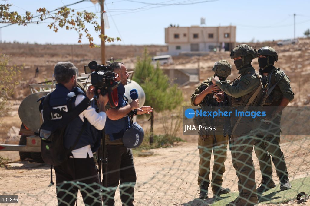WADI AL-RAKHIM, YATTA, HEBRON, PALESTINE – OCTOBER 7, 2026: Israeli settlers continued to surround the home of Palestinian Yusuf Shnaran’s family in Wadi al-Rakhim, east of Yatta, south of Hebron, amid the presence of Israeli forces in the area since the previous night. According to the provided information, settlers had attacked the house and assaulted family members, injuring two of them. The situation continued on October 7 as settlers remained around the family home while Israeli forces were present in the area. Photo by Mosab Shawar / JNA Press. (Photo by Mosab shawer/JNA Press via Nexpher Images)