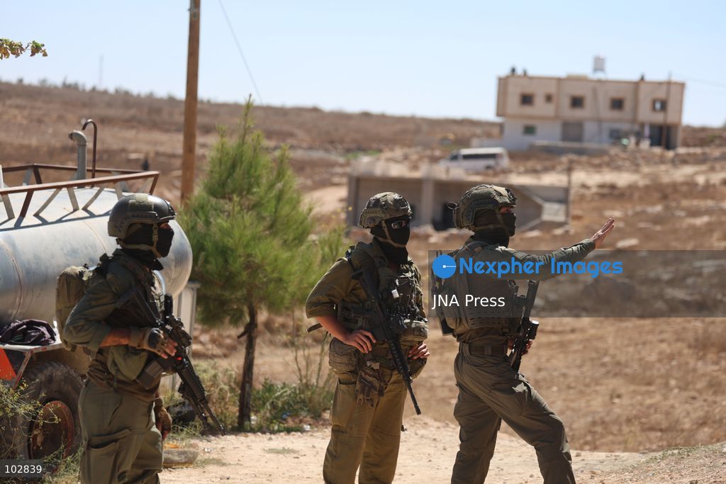 WADI AL-RAKHIM, YATTA, HEBRON, PALESTINE – OCTOBER 7, 2026: Israeli settlers continued to surround the home of Palestinian Yusuf Shnaran’s family in Wadi al-Rakhim, east of Yatta, south of Hebron, amid the presence of Israeli forces in the area since the previous night. According to the provided information, settlers had attacked the house and assaulted family members, injuring two of them. The situation continued on October 7 as settlers remained around the family home while Israeli forces were present in the area. Photo by Mosab Shawar / JNA Press. (Photo by Mosab shawer/JNA Press via Nexpher Images)