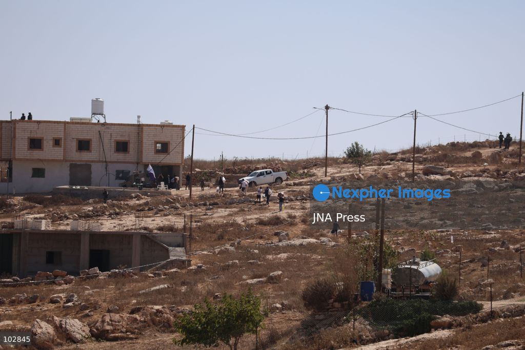 WADI AL-RAKHIM, YATTA, HEBRON, PALESTINE – OCTOBER 7, 2026: Israeli settlers continued to surround the home of Palestinian Yusuf Shnaran’s family in Wadi al-Rakhim, east of Yatta, south of Hebron, amid the presence of Israeli forces in the area since the previous night. According to the provided information, settlers had attacked the house and assaulted family members, injuring two of them. The situation continued on October 7 as settlers remained around the family home while Israeli forces were present in the area. Photo by Mosab Shawer / JNA Press. (Photo by Mosab shawer/JNA Press via Nexpher Images)