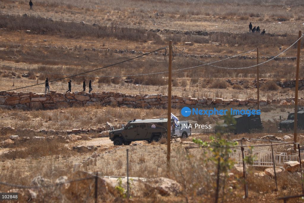 WADI AL-RAKHIM, YATTA, HEBRON, PALESTINE – OCTOBER 7, 2026: Israeli settlers continued to surround the home of Palestinian Yusuf Shnaran’s family in Wadi al-Rakhim, east of Yatta, south of Hebron, amid the presence of Israeli forces in the area since the previous night. According to the provided information, settlers had attacked the house and assaulted family members, injuring two of them. The situation continued on October 7 as settlers remained around the family home while Israeli forces were present in the area. Photo by Mosab Shawar / JNA Press. (Photo by Mosab shawer/JNA Press via Nexpher Images)