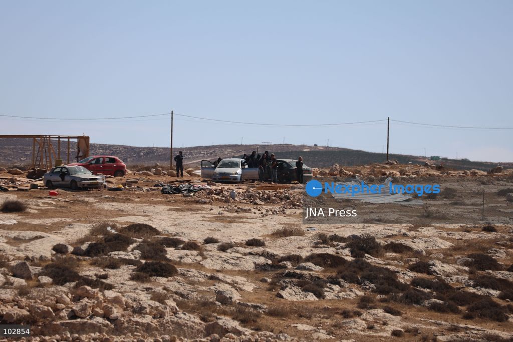 WADI AL-RAKHIM, YATTA, HEBRON, PALESTINE – OCTOBER 7, 2026: Israeli settlers continued to surround the home of Palestinian Yusuf Shnaran’s family in Wadi al-Rakhim, east of Yatta, south of Hebron, amid the presence of Israeli forces in the area since the previous night. According to the provided information, settlers had attacked the house and assaulted family members, injuring two of them. The situation continued on October 7 as settlers remained around the family home while Israeli forces were present in the area. Photo by Mosab Shawar / JNA Press. (Photo by Mosab shawer/JNA Press via Nexpher Images)