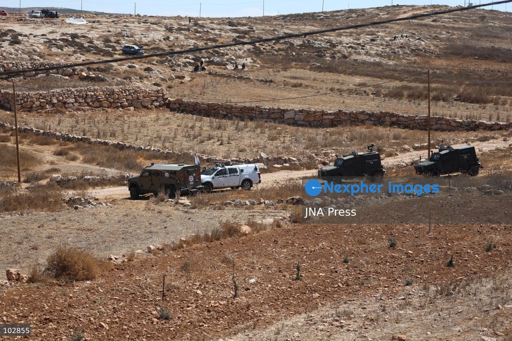 WADI AL-RAKHIM, YATTA, HEBRON, PALESTINE – OCTOBER 7, 2026: Israeli settlers continued to surround the home of Palestinian Yusuf Shnaran’s family in Wadi al-Rakhim, east of Yatta, south of Hebron, amid the presence of Israeli forces in the area since the previous night. According to the provided information, settlers had attacked the house and assaulted family members, injuring two of them. The situation continued on October 7 as settlers remained around the family home while Israeli forces were present in the area. Photo by Mosab Shawar / JNA Press. (Photo by Mosab shawer/JNA Press via Nexpher Images)