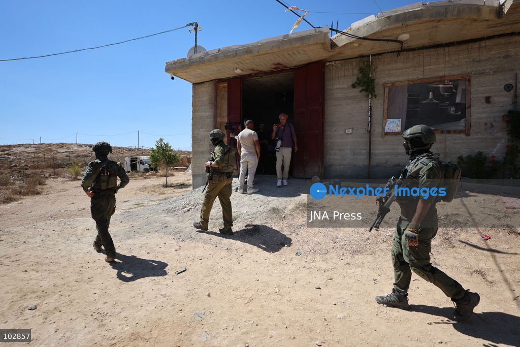 WADI AL-RAKHIM, YATTA, HEBRON, PALESTINE – OCTOBER 7, 2026: Israeli settlers continued to surround the home of Palestinian Yusuf Shnaran’s family in Wadi al-Rakhim, east of Yatta, south of Hebron, amid the presence of Israeli forces in the area since the previous night. According to the provided information, settlers had attacked the house and assaulted family members, injuring two of them. The situation continued on October 7 as settlers remained around the family home while Israeli forces were present in the area. Photo by Mosab Shawar / JNA Press. (Photo by Mosab shawer/JNA Press via Nexpher Images)