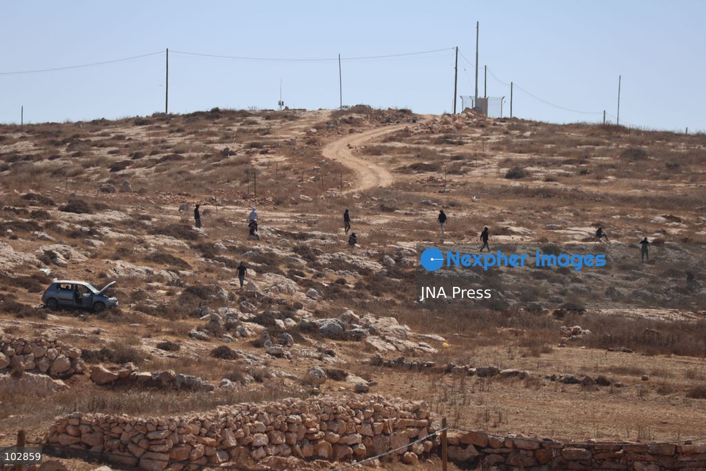 WADI AL-RAKHIM, YATTA, HEBRON, PALESTINE – OCTOBER 7, 2026: Israeli settlers continued to surround the home of Palestinian Yusuf Shnaran’s family in Wadi al-Rakhim, east of Yatta, south of Hebron, amid the presence of Israeli forces in the area since the previous night. According to the provided information, settlers had attacked the house and assaulted family members, injuring two of them. The situation continued on October 7 as settlers remained around the family home while Israeli forces were present in the area. Photo by Mosab Shawar / JNA Press. (Photo by Mosab shawer/JNA Press via Nexpher Images)