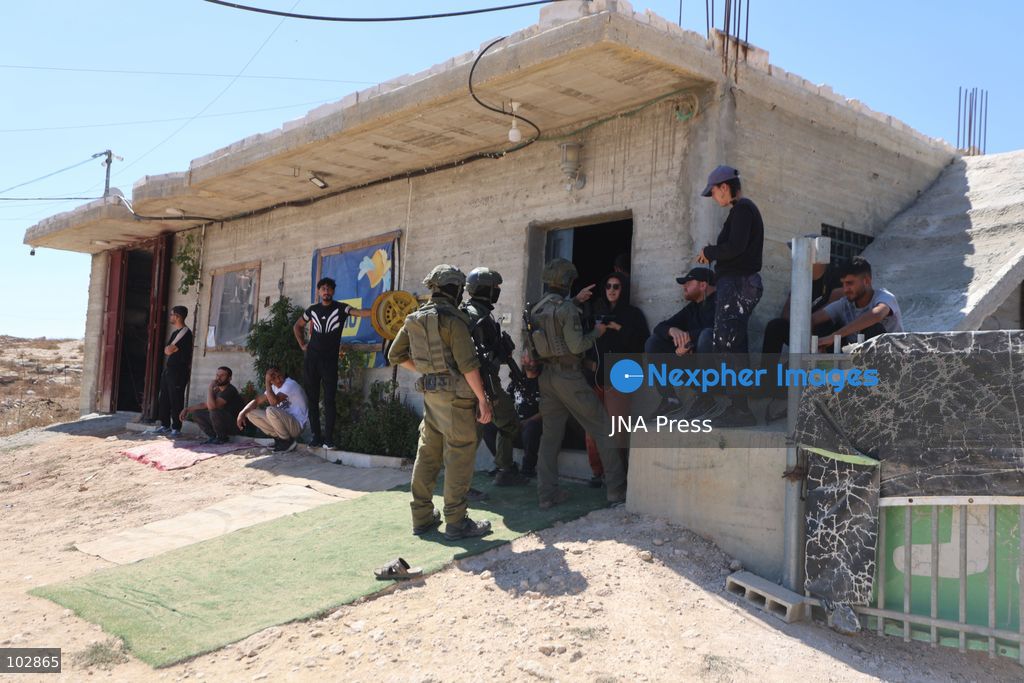 WADI AL-RAKHIM, YATTA, HEBRON, PALESTINE – OCTOBER 7, 2026: Israeli settlers continued to surround the home of Palestinian Yusuf Shnaran’s family in Wadi al-Rakhim, east of Yatta, south of Hebron, amid the presence of Israeli forces in the area since the previous night. According to the provided information, settlers had attacked the house and assaulted family members, injuring two of them. The situation continued on October 7 as settlers remained around the family home while Israeli forces were present in the area. Photo by Mosab Shawar / JNA Press. (Photo by Mosab shawer/JNA Press via Nexpher Images)