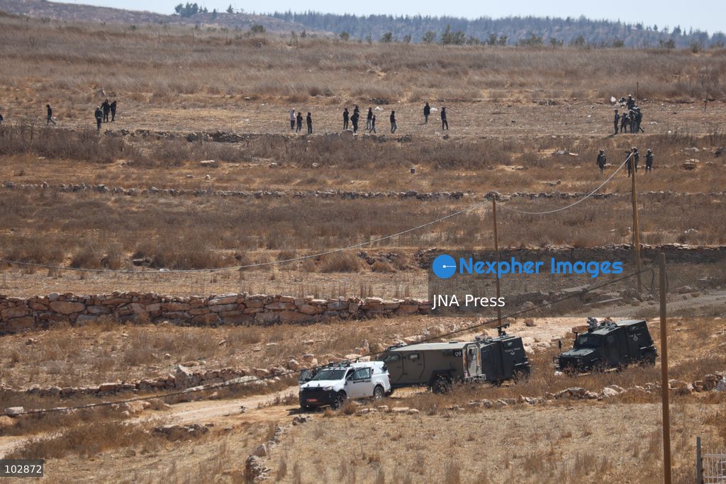 WADI AL-RAKHIM, YATTA, HEBRON, PALESTINE – OCTOBER 7, 2026: Israeli settlers continued to surround the home of Palestinian Yusuf Shnaran’s family in Wadi al-Rakhim, east of Yatta, south of Hebron, amid the presence of Israeli forces in the area since the previous night. According to the provided information, settlers had attacked the house and assaulted family members, injuring two of them. The situation continued on October 7 as settlers remained around the family home while Israeli forces were present in the area. Photo by Mosab Shawar / JNA Press. (Photo by Mosab shawer/JNA Press via Nexpher Images)