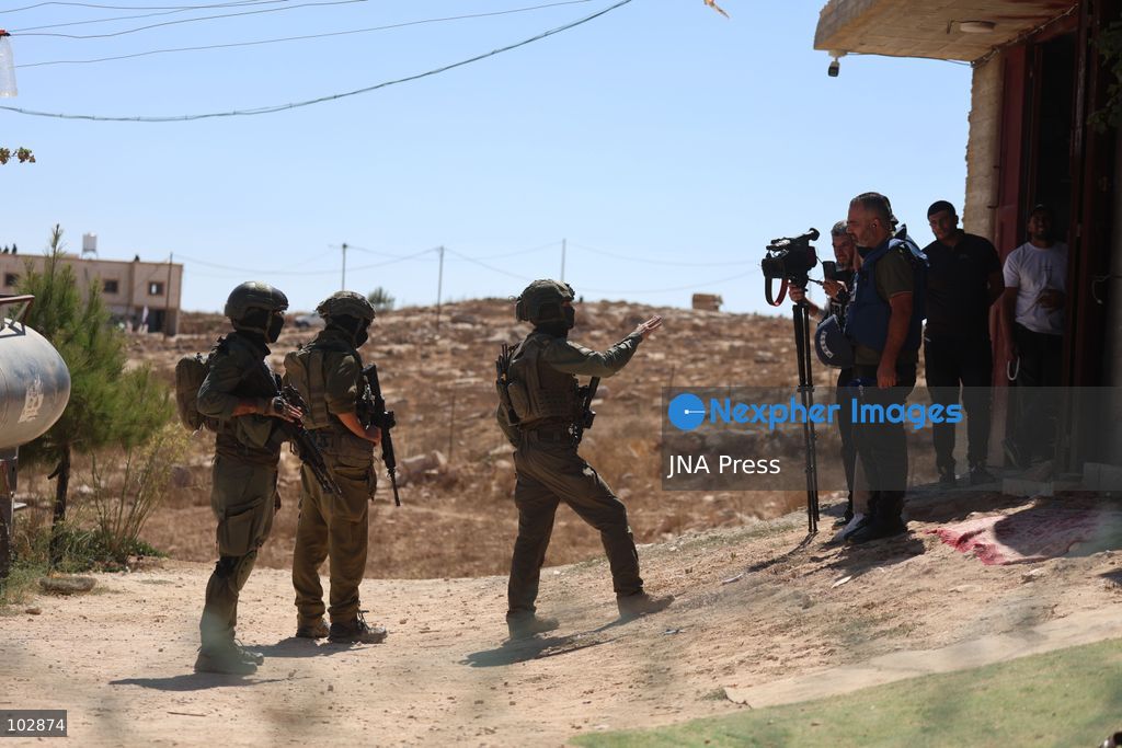 WADI AL-RAKHIM, YATTA, HEBRON, PALESTINE – OCTOBER 7, 2026: Israeli settlers continued to surround the home of Palestinian Yusuf Shnaran’s family in Wadi al-Rakhim, east of Yatta, south of Hebron, amid the presence of Israeli forces in the area since the previous night. According to the provided information, settlers had attacked the house and assaulted family members, injuring two of them. The situation continued on October 7 as settlers remained around the family home while Israeli forces were present in the area. Photo by Mosab Shawar / JNA Press. (Photo by Mosab shawer/JNA Press via Nexpher Images)