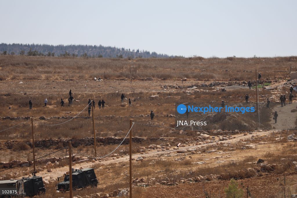 WADI AL-RAKHIM, YATTA, HEBRON, PALESTINE – OCTOBER 7, 2026: Israeli settlers continued to surround the home of Palestinian Yusuf Shnaran’s family in Wadi al-Rakhim, east of Yatta, south of Hebron, amid the presence of Israeli forces in the area since the previous night. According to the provided information, settlers had attacked the house and assaulted family members, injuring two of them. The situation continued on October 7 as settlers remained around the family home while Israeli forces were present in the area. Photo by Mosab Shawar / JNA Press. (Photo by Mosab shawer/JNA Press via Nexpher Images)