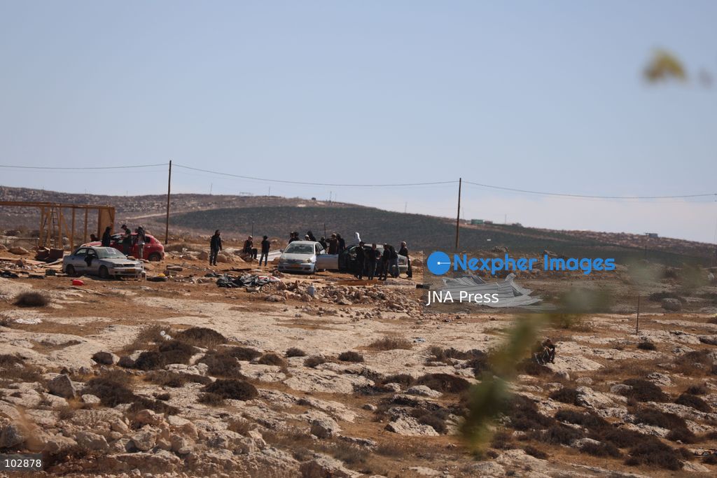WADI AL-RAKHIM, YATTA, HEBRON, PALESTINE – OCTOBER 7, 2026: Israeli settlers continued to surround the home of Palestinian Yusuf Shnaran’s family in Wadi al-Rakhim, east of Yatta, south of Hebron, amid the presence of Israeli forces in the area since the previous night. According to the provided information, settlers had attacked the house and assaulted family members, injuring two of them. The situation continued on October 7 as settlers remained around the family home while Israeli forces were present in the area. Photo by Mosab Shawar / JNA Press. (Photo by Mosab shawer/JNA Press via Nexpher Images)