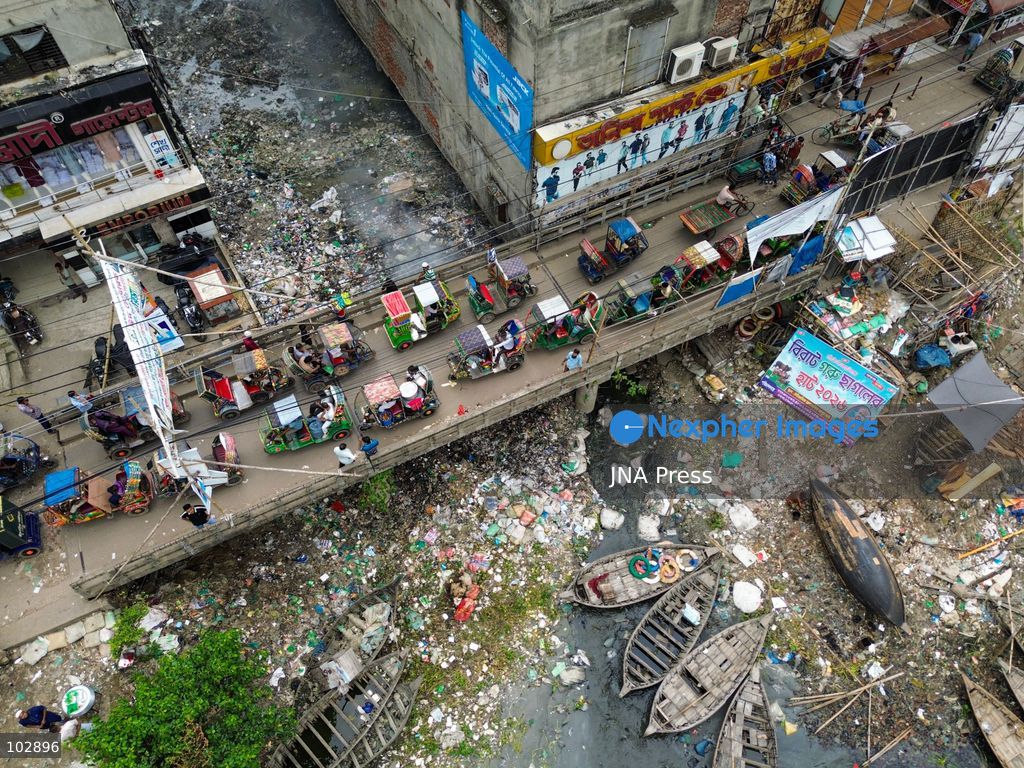 DHAKA, Bangladesh — Oct. 7, 2026: Discarded plastic, household refuse and other waste line sections of the Buriganga River and its waterways, including parts of its historic channel in Dhaka. The accumulation reflects a wider pollution problem affecting rivers and aquatic environments around the world. The Buriganga, an important waterway for Dhaka, receives waste from surrounding communities and industrial areas. Persistent plastic pollution has contributed to the degradation of the river and poses broader challenges for aquatic ecosystems, water quality and communities that depend on waterways. (Photo by Bipul Ahmed/JNA Press via Nexpher Images)