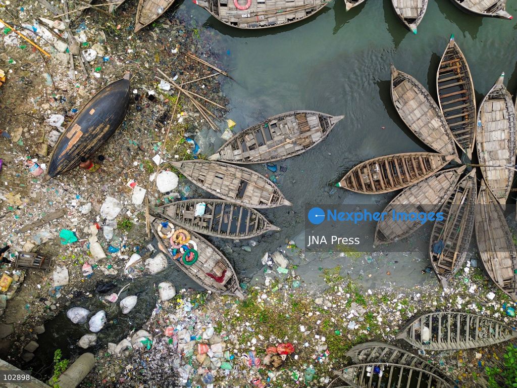 DHAKA, Bangladesh — Oct. 7, 2026: Discarded plastic, household refuse and other waste line sections of the Buriganga River and its waterways, including parts of its historic channel in Dhaka. The accumulation reflects a wider pollution problem affecting rivers and aquatic environments around the world. The Buriganga, an important waterway for Dhaka, receives waste from surrounding communities and industrial areas. Persistent plastic pollution has contributed to the degradation of the river and poses broader challenges for aquatic ecosystems, water quality and communities that depend on waterways. (Photo by Bipul Ahmed/JNA Press via Nexpher Images)