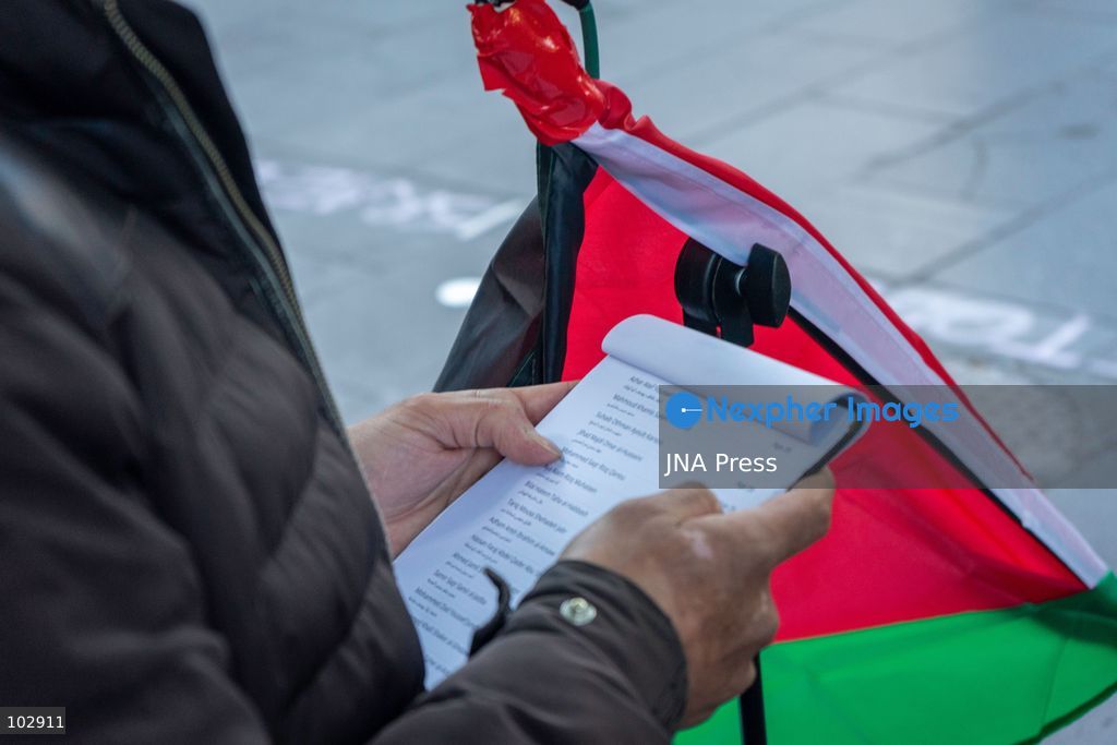 MELBOURNE, AUSTRALIA – OCTOBER 7, 2026: A day-long vigil in solidarity with the people of Gaza was held at the State Library of Victoria, with attendees taking part in a sit-in from 10:00 AM to 5:00 PM, followed by a commemoration from 5:00 PM to 6:00 PM to honour and remember people killed in Gaza. During the vigil, attendees made paper poppies and placed them throughout the garden in front of the library. A car marked with numerous bullet holes, presented as a representation of the vehicle in which Hind Rajab was trapped and killed in Gaza, was displayed at the site. A recording of Rajab's final call for help was also played over a speaker. The names and ages of people who had died were read aloud during the commemoration. Photo by Huda Shehzad / JNA Press. (Photo by Huda Shehzad/JNA Press via Nexpher Images)