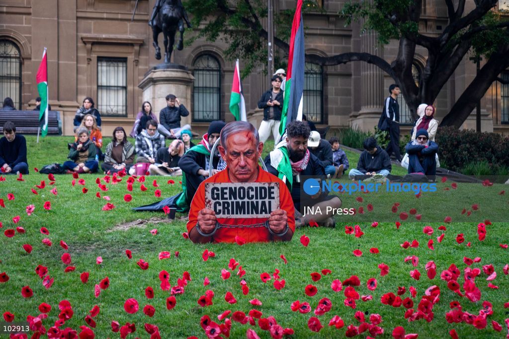 MELBOURNE, AUSTRALIA – OCTOBER 7, 2026: A day-long vigil in solidarity with the people of Gaza was held at the State Library of Victoria, with attendees taking part in a sit-in from 10:00 AM to 5:00 PM, followed by a commemoration from 5:00 PM to 6:00 PM to honour and remember people killed in Gaza. During the vigil, attendees made paper poppies and placed them throughout the garden in front of the library. A car marked with numerous bullet holes, presented as a representation of the vehicle in which Hind Rajab was trapped and killed in Gaza, was displayed at the site. A recording of Rajab's final call for help was also played over a speaker. The names and ages of people who had died were read aloud during the commemoration. Photo by Huda Shehzad / JNA Press. (Photo by Huda Shehzad/JNA Press via Nexpher Images)