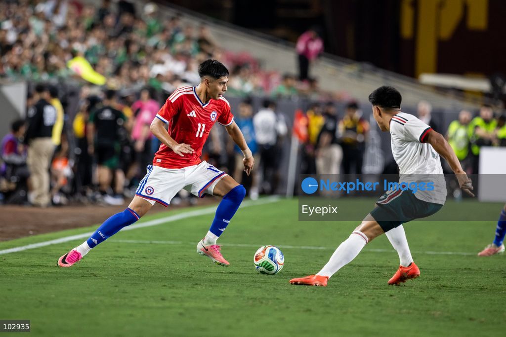 Darío Osorio #11 of Chile national team is pressured by Jesus Gallardo #23 of Mexico national team during the International Friendly football match between Mexico and Chile at Los Angeles Memorial Coliseum on October 6, 2026 in Pasadena, California. (Photo by Arturo Cordero / Eyepix Group) (Photo by Arturo Cordero / Eyepix Group/Eyepix via Nexpher Images)