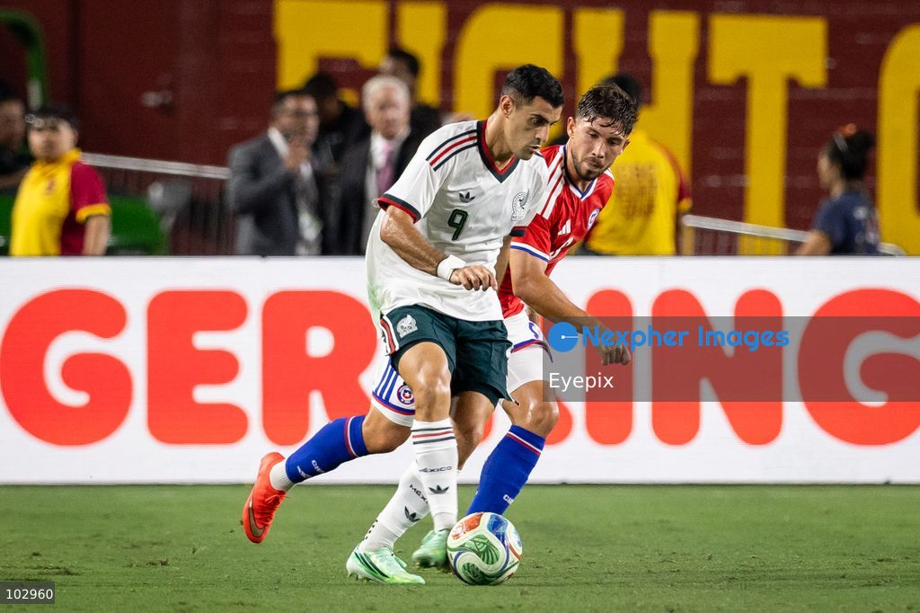 Felipe Loyola #8 of Chile national team and Germán Berterame #9 of Mexico national team battle for the ball during the International Friendly football match between Mexico and Chile at Los Angeles Memorial Coliseum on October 6, 2026 in Pasadena, California. (Photo by Arturo Cordero / Eyepix Group) (Photo by Arturo Cordero / Eyepix Group/Eyepix via Nexpher Images)