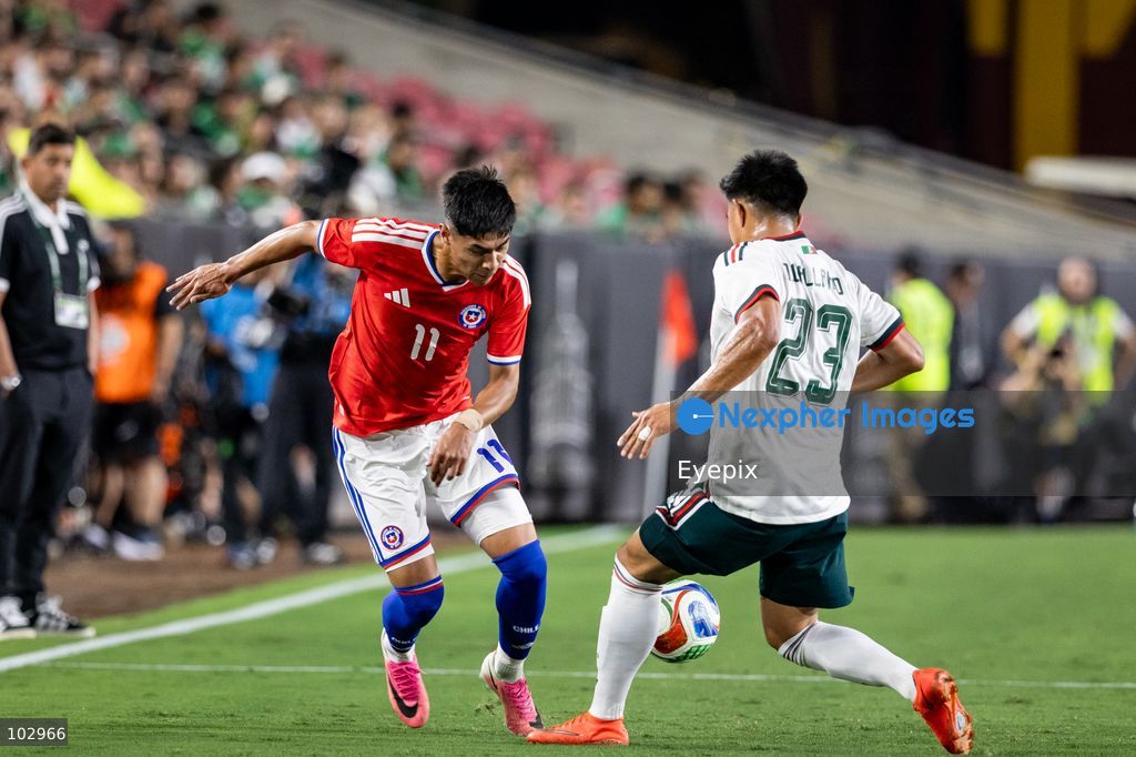 Darío Osorio #11 of Chile national team is pressured by Jesus Gallardo #23 of Mexico national team during the International Friendly football match between Mexico and Chile at Los Angeles Memorial Coliseum on October 6, 2026 in Pasadena, California. (Photo by Arturo Cordero / Eyepix Group) (Photo by Arturo Cordero / Eyepix Group/Eyepix via Nexpher Images)