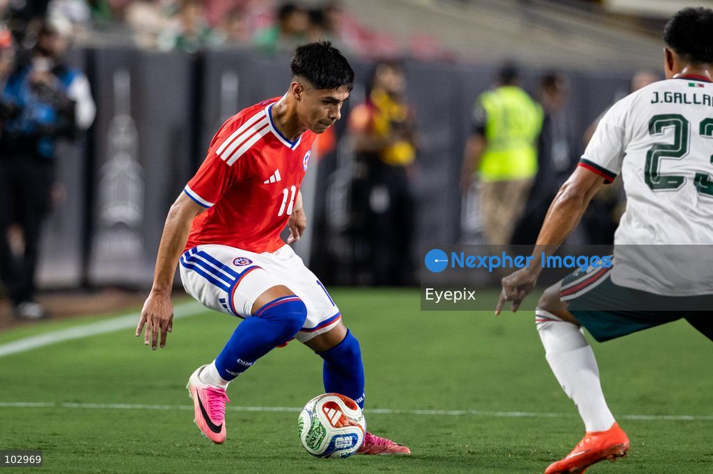 Darío Osorio #11 of Chile national team is pressured by Jesus Gallardo #23 of Mexico national team during the International Friendly football match between Mexico and Chile at Los Angeles Memorial Coliseum on October 6, 2026 in Pasadena, California. (Photo by Arturo Cordero / Eyepix Group) (Photo by Arturo Cordero / Eyepix Group/Eyepix via Nexpher Images)