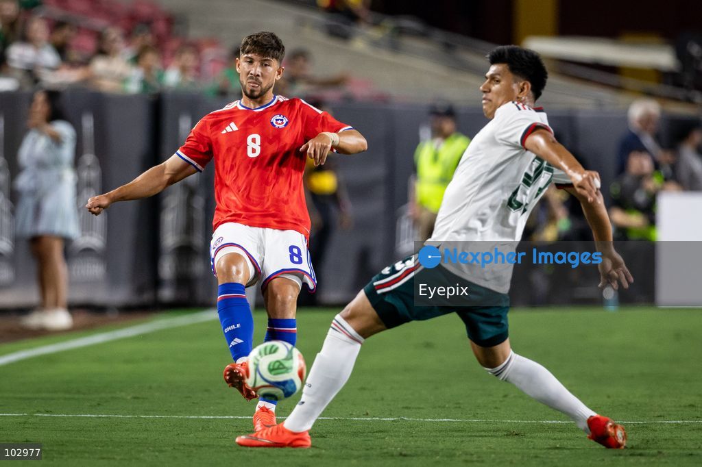 Felipe Loyola #8 of Chile national team is pressured by Jesus Gallardo #23 of Mexico national team during the International Friendly football match between Mexico and Chile at Los Angeles Memorial Coliseum on October 6, 2026 in Pasadena, California. (Photo by Arturo Cordero / Eyepix Group) (Photo by Arturo Cordero / Eyepix Group/Eyepix via Nexpher Images)