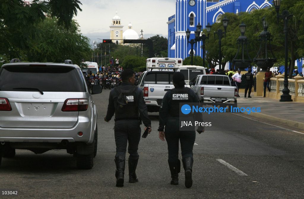 MARACAIBO, VENEZUELA, OCTOBER 7, 2026: Government supporters and state security personnel gather in central Maracaibo during an event marking the 14th anniversary of Hugo Chavez's 2012 presidential election victory. Zulia Governor Luis Caldera attended the commemoration as government supporters marched through the city. The event took place amid heightened political tensions and continuing public complaints over prolonged electricity outages in Zulia. Opposition activists from Vente Venezuela alleged that government resources and security deployments were used to obstruct a separate protest over electricity rationing, a claim that could not be independently verified. Photo by Humberto Matheus / JNA PRESS (Photo by Humberto Matheus/JNA Press via Nexpher Images)