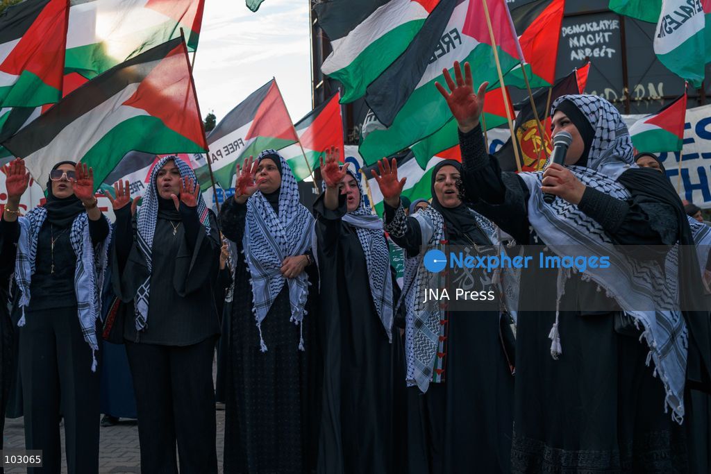 BERLIN, GERMANY, OCTOBER 7, 2026: Demonstrators gather at Checkpoint Charlie in central Berlin to mark three years since the start of the Gaza war. Participants protest against Israel’s military actions in Gaza, which they describe as genocide, and express solidarity with Palestinians. Photo by Nikos Kanistras / JNA Press. (Photo by Nikos Kanistras/JNA Press via Nexpher Images)