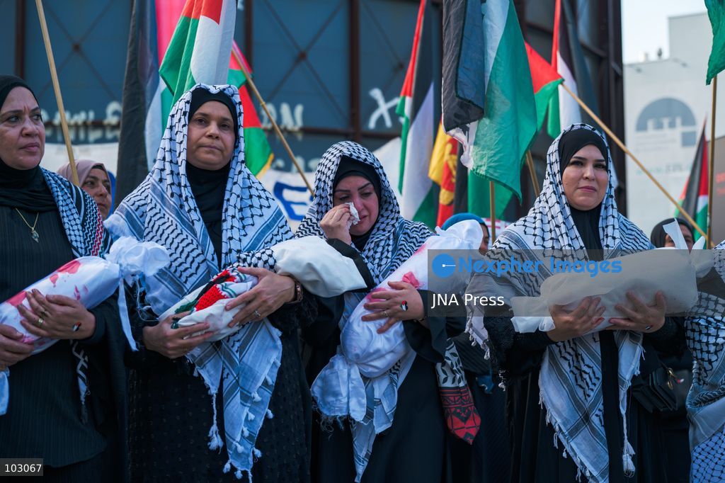 BERLIN, GERMANY, OCTOBER 7, 2026: Demonstrators gather at Checkpoint Charlie in central Berlin to mark three years since the start of the Gaza war. Participants protest against Israel’s military actions in Gaza, which they describe as genocide, and express solidarity with Palestinians. Photo by Nikos Kanistras / JNA Press. (Photo by Nikos Kanistras/JNA Press via Nexpher Images)