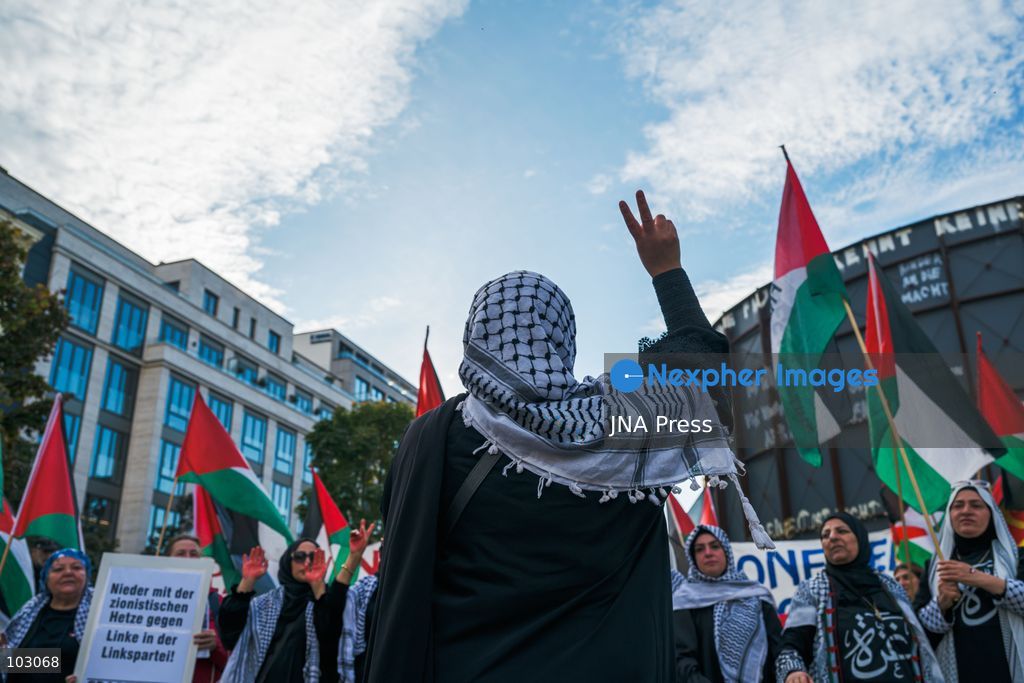 BERLIN, GERMANY, OCTOBER 7, 2026: Demonstrators gather at Checkpoint Charlie in central Berlin to mark three years since the start of the Gaza war. Participants protest against Israel’s military actions in Gaza, which they describe as genocide, and express solidarity with Palestinians. Photo by Nikos Kanistras / JNA Press. (Photo by Nikos Kanistras/JNA Press via Nexpher Images)