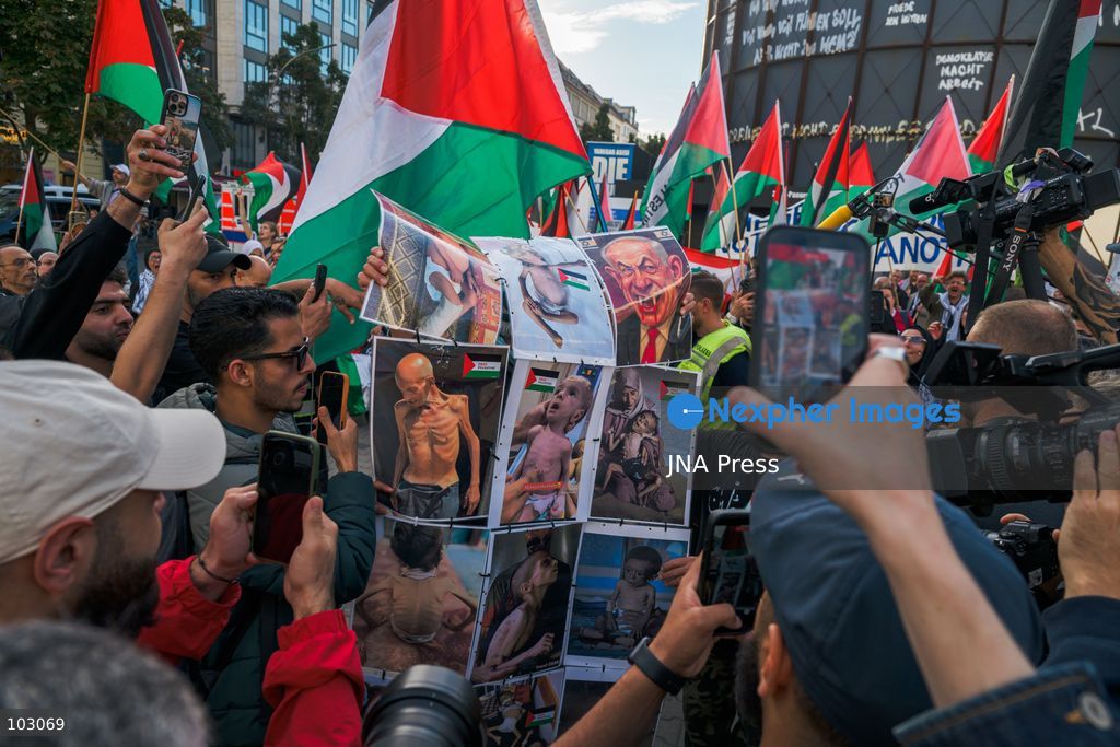 BERLIN, GERMANY, OCTOBER 7, 2026: Demonstrators gather at Checkpoint Charlie in central Berlin to mark three years since the start of the Gaza war. Participants protest against Israel’s military actions in Gaza, which they describe as genocide, and express solidarity with Palestinians. Photo by Nikos Kanistras / JNA Press. (Photo by Nikos Kanistras/JNA Press via Nexpher Images)