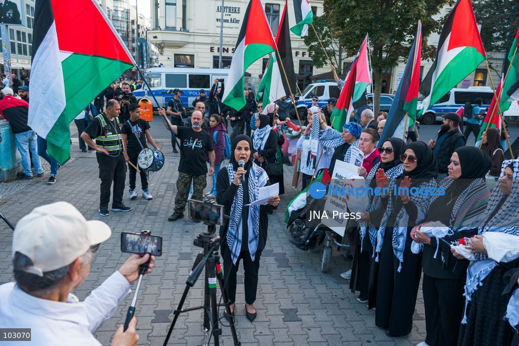 BERLIN, GERMANY, OCTOBER 7, 2026: Demonstrators gather at Checkpoint Charlie in central Berlin to mark three years since the start of the Gaza war. Participants protest against Israel’s military actions in Gaza, which they describe as genocide, and express solidarity with Palestinians. Photo by Nikos Kanistras / JNA Press. (Photo by Nikos Kanistras/JNA Press via Nexpher Images)