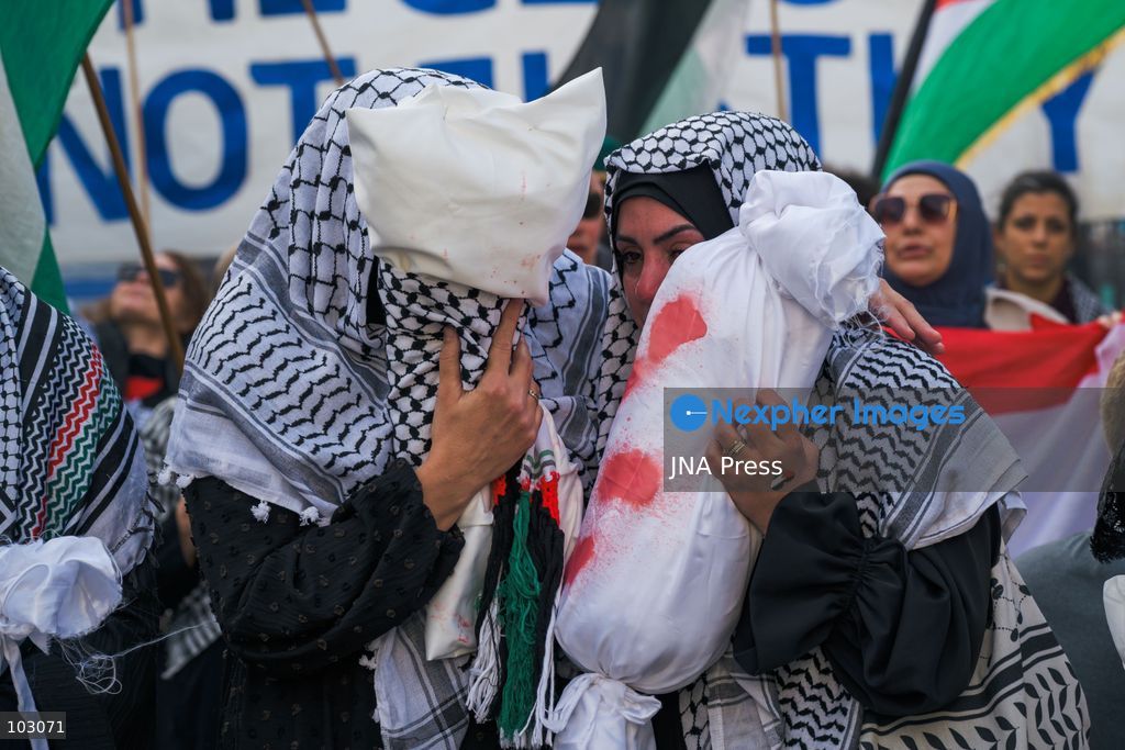 BERLIN, GERMANY, OCTOBER 7, 2026: Demonstrators gather at Checkpoint Charlie in central Berlin to mark three years since the start of the Gaza war. Participants protest against Israel’s military actions in Gaza, which they describe as genocide, and express solidarity with Palestinians. Photo by Nikos Kanistras / JNA Press. (Photo by Nikos Kanistras/JNA Press via Nexpher Images)