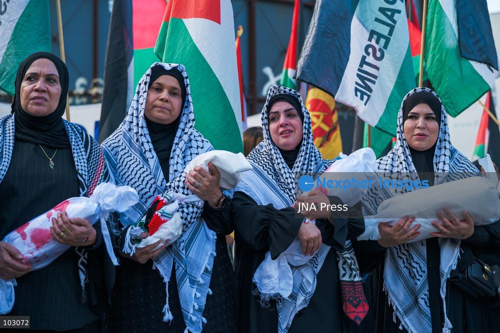 BERLIN, GERMANY, OCTOBER 7, 2026: Demonstrators gather at Checkpoint Charlie in central Berlin to mark three years since the start of the Gaza war. Participants protest against Israel’s military actions in Gaza, which they describe as genocide, and express solidarity with Palestinians. Photo by Nikos Kanistras / JNA Press. (Photo by Nikos Kanistras/JNA Press via Nexpher Images)