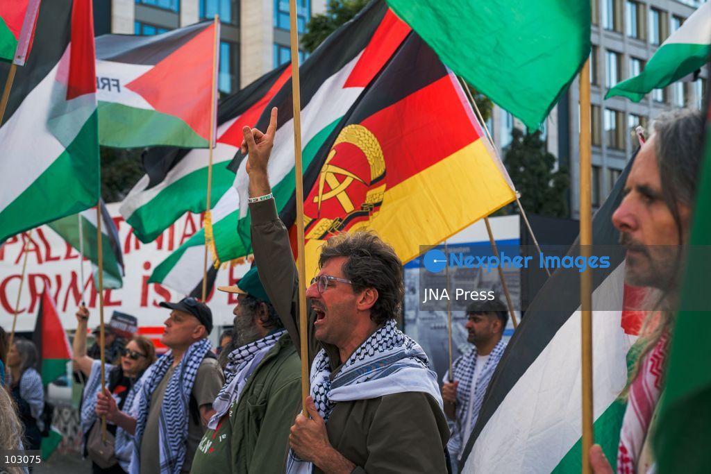 BERLIN, GERMANY, OCTOBER 7, 2026: Demonstrators gather at Checkpoint Charlie in central Berlin to mark three years since the start of the Gaza war. Participants protest against Israel’s military actions in Gaza, which they describe as genocide, and express solidarity with Palestinians. Photo by Nikos Kanistras / JNA Press. (Photo by Nikos Kanistras/JNA Press via Nexpher Images)